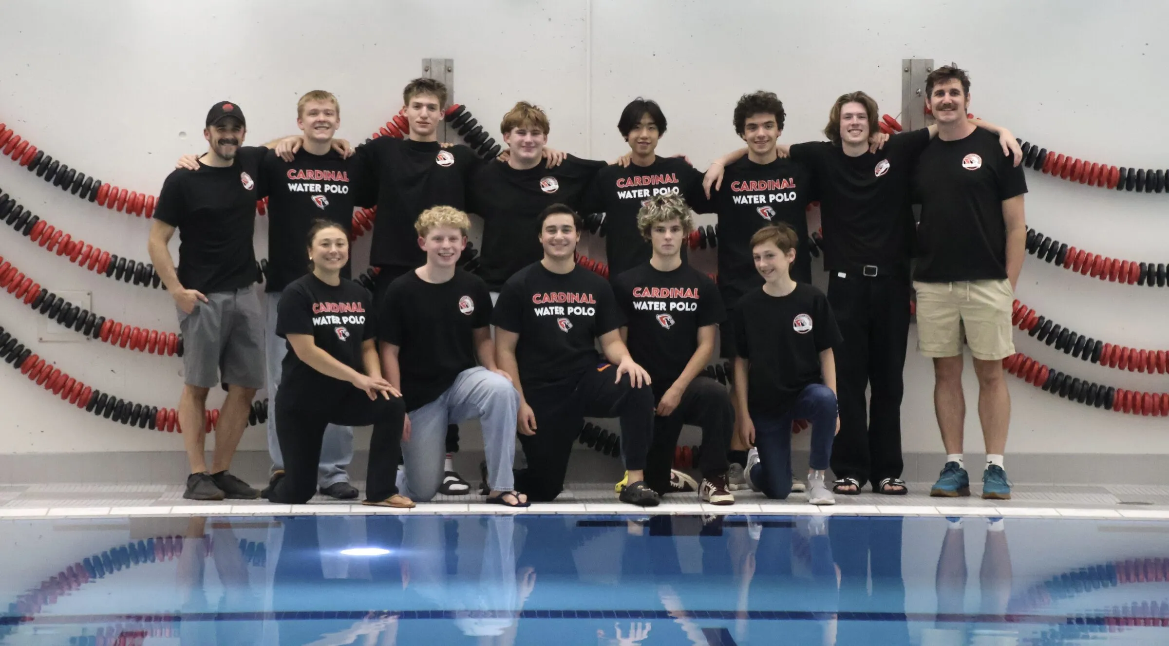 The boys team lined up at the pool