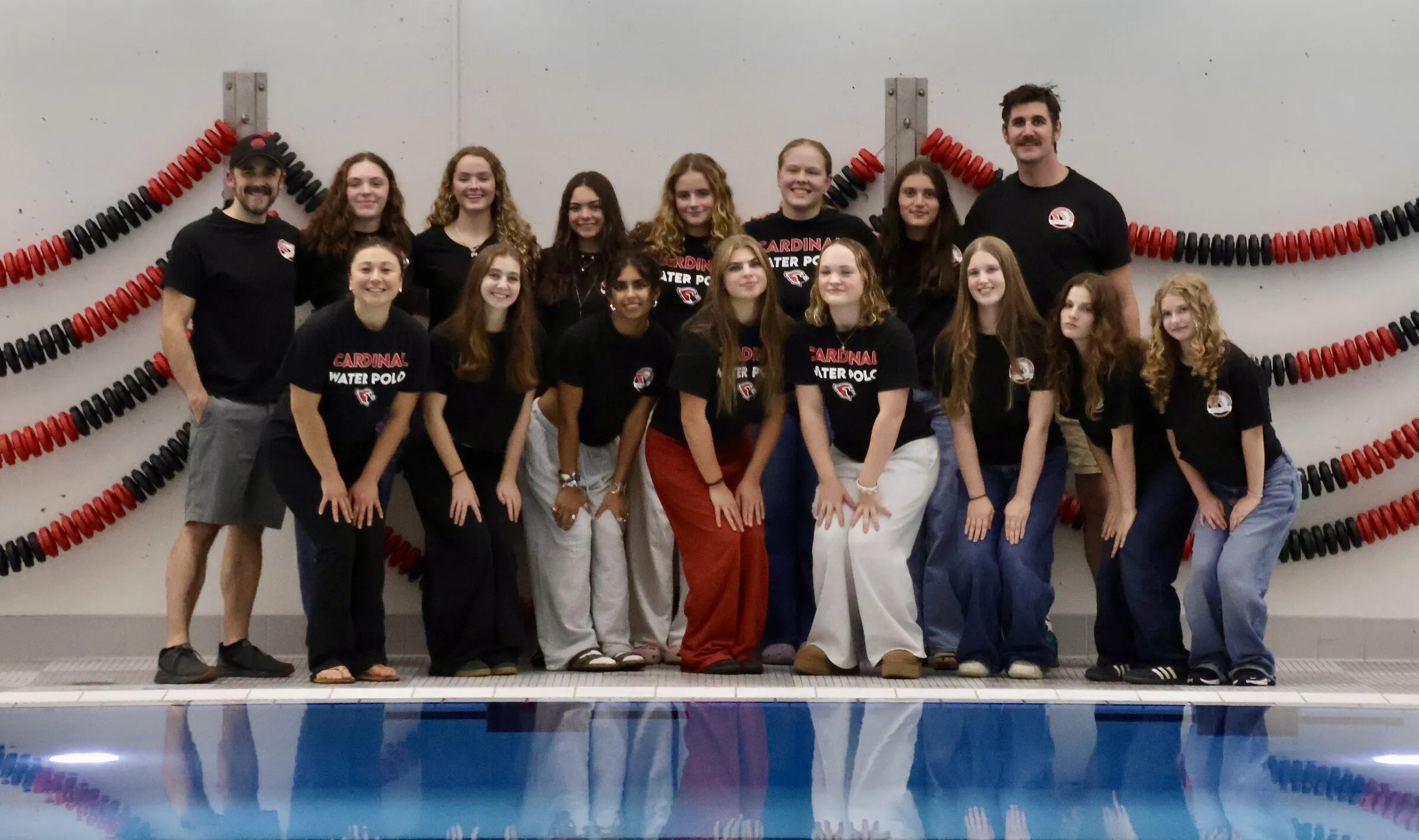 The girls team lined up at the pool