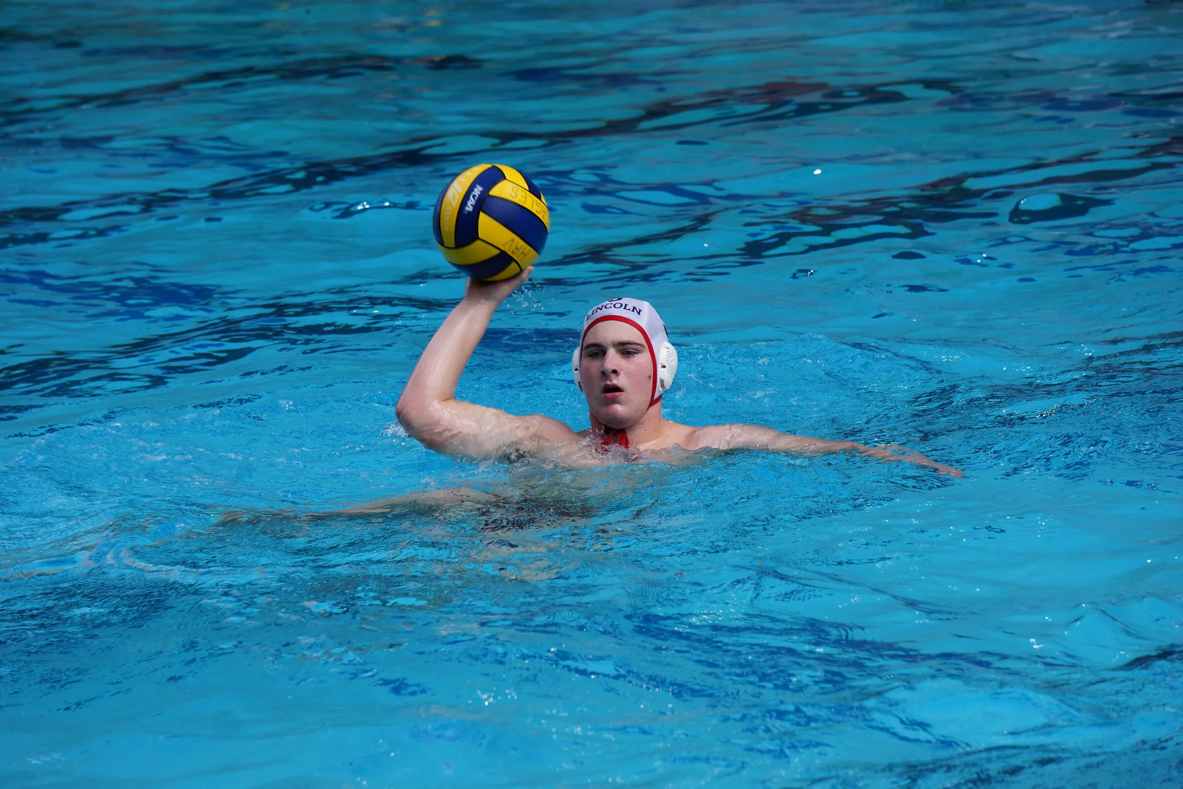 A player sets up with the ball in open water