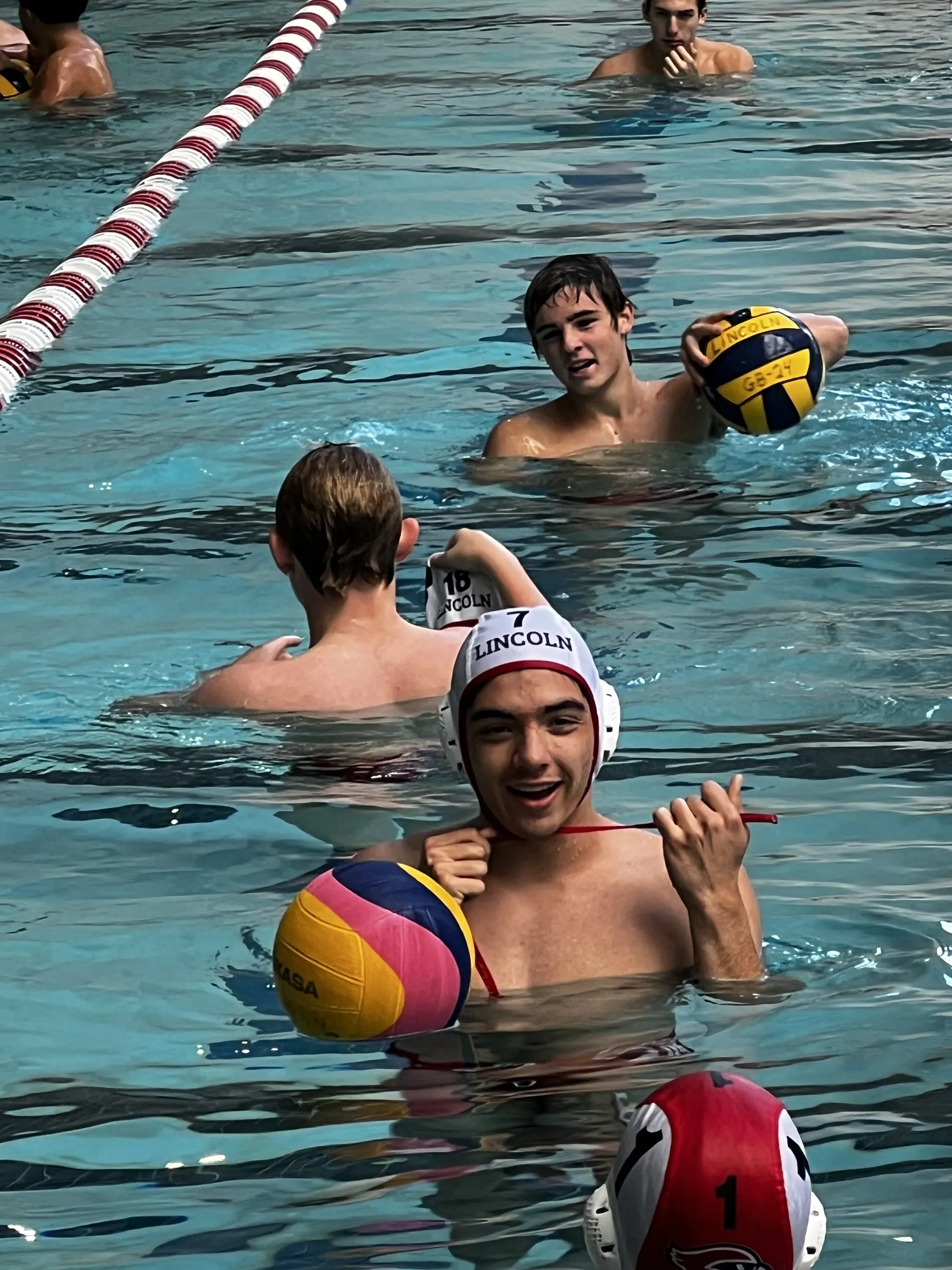 Two players warm up with the ball before a game