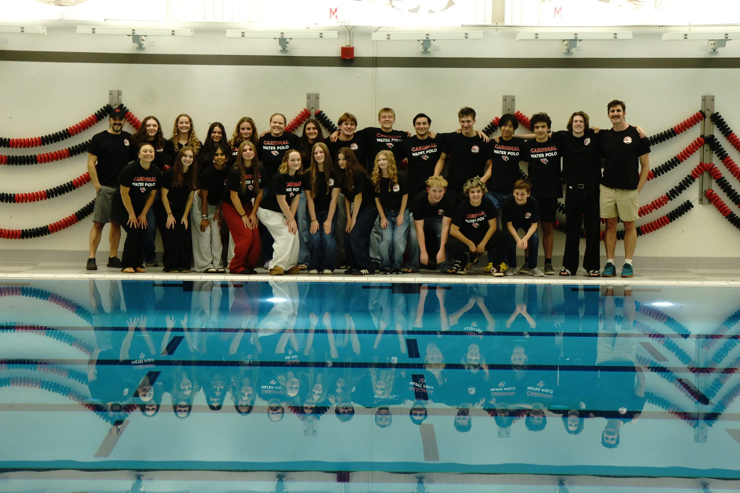 The whole program lined up along the pool